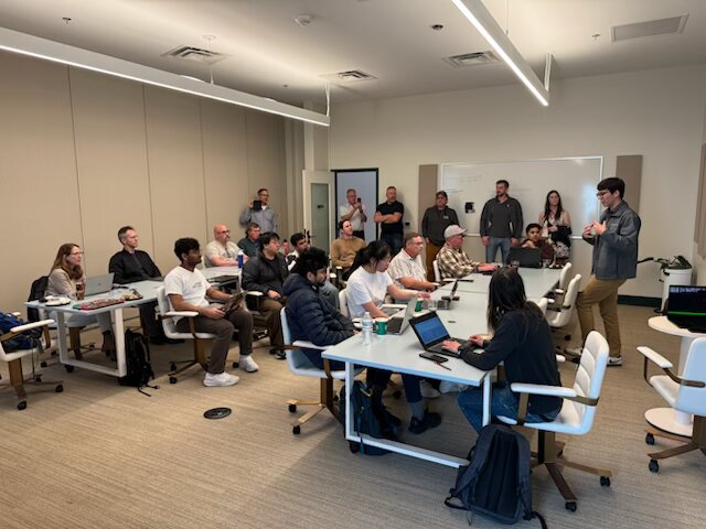 Full room of attendees at the hackathon workshop